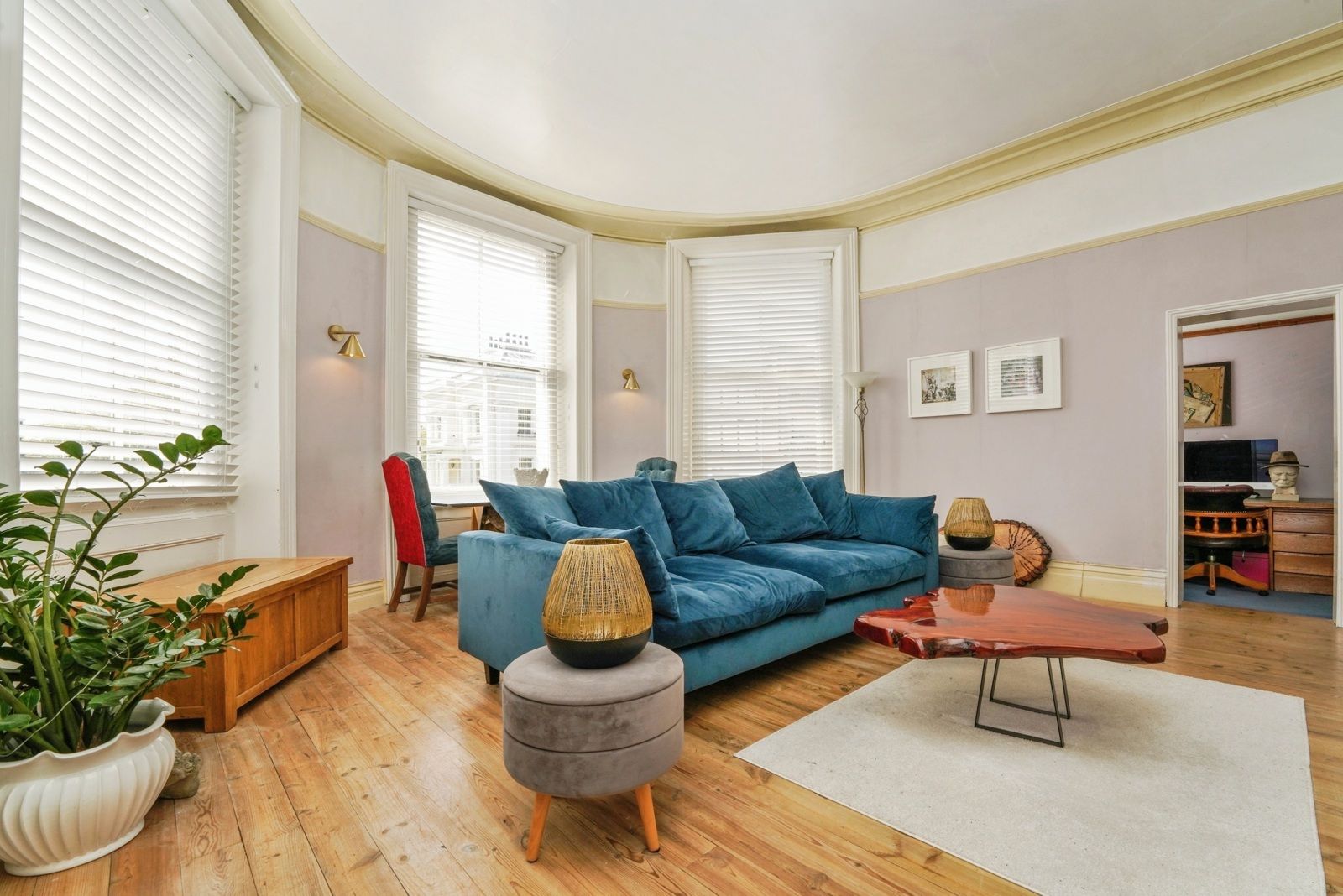 The bay-windowed lounge and dining room at 1 Bayshill Lodge
